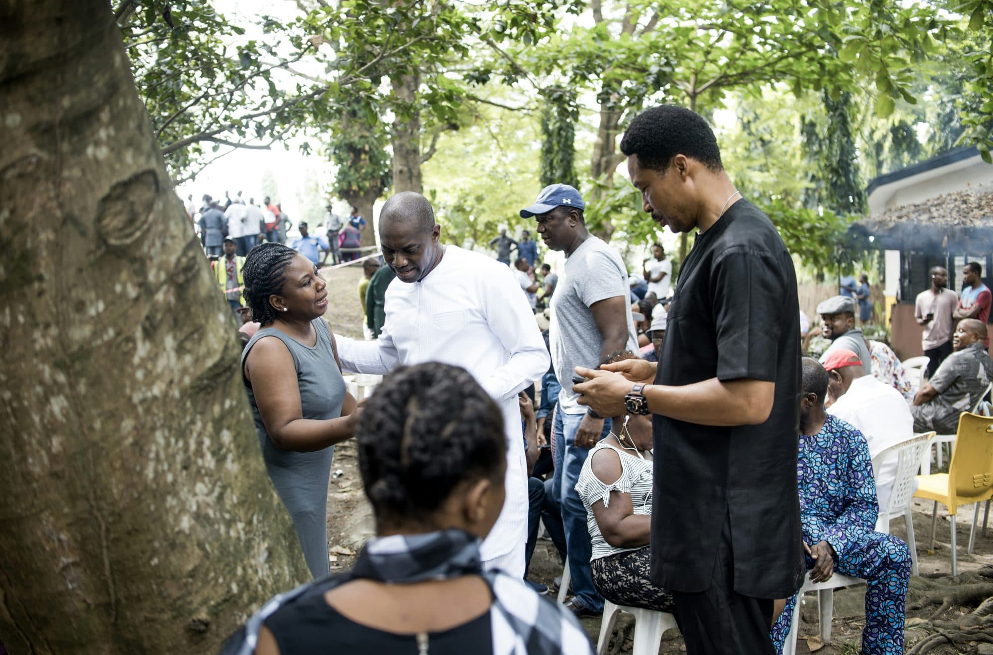 Volunteers helping people in a community outdoors